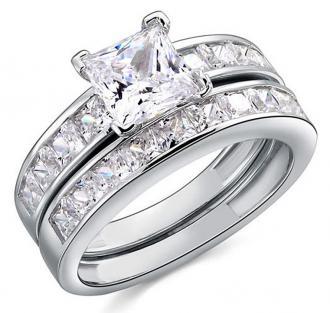 Zásnubní prsten dvouřádkový z bílého zlata zdobený diamanty a větším bílým diamantem